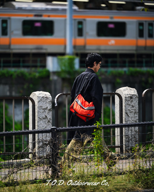 Ochanomizu walks with OWC II(ALL BLACK) on.